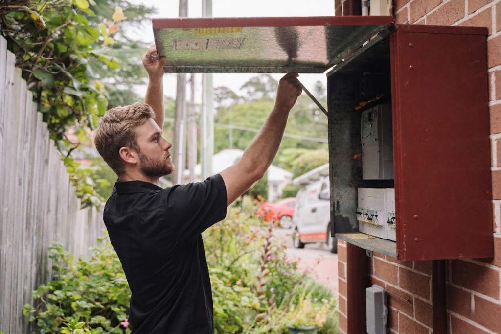 Electrician installing downlights in a Bellevue Hill home